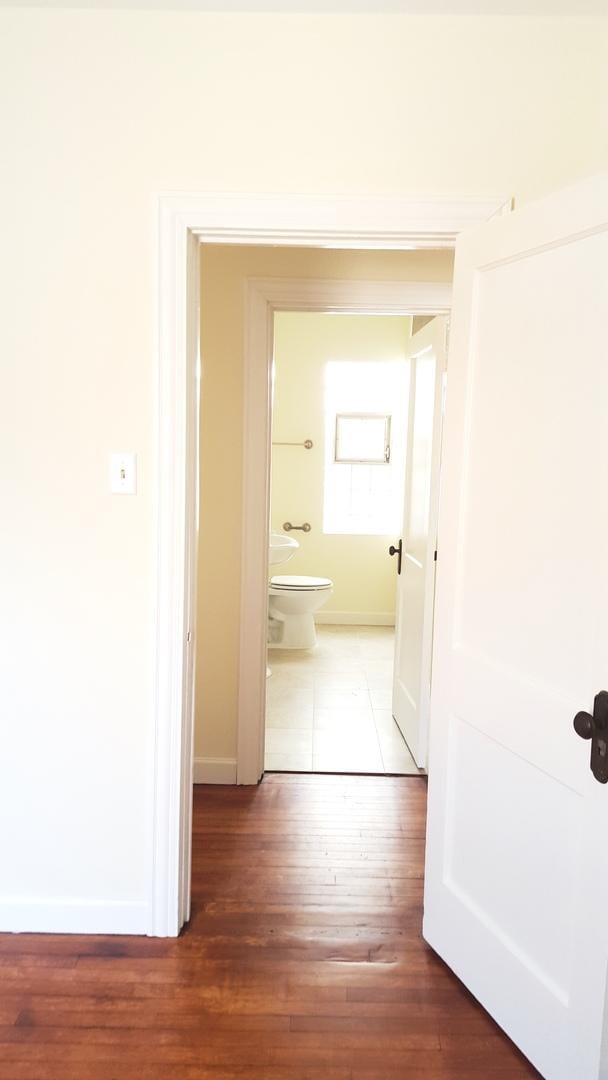 corridor featuring hardwood / wood-style flooring