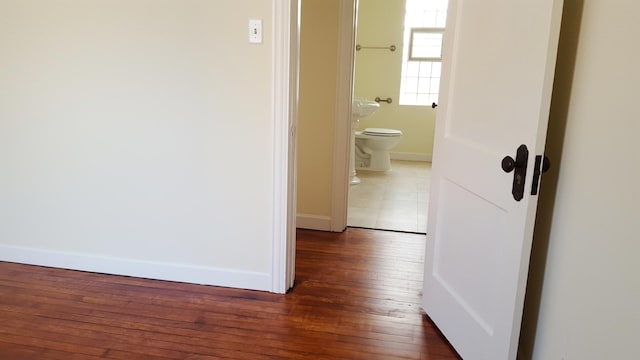 hall featuring dark wood-type flooring