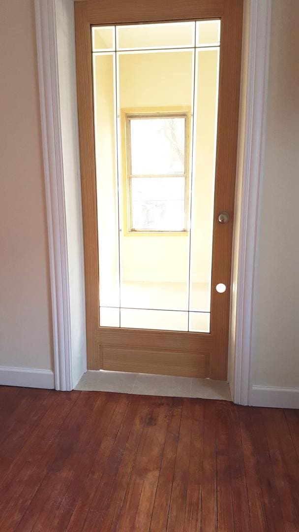 doorway featuring wood-type flooring