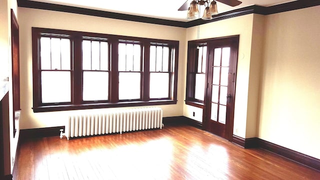 interior space featuring ceiling fan and radiator