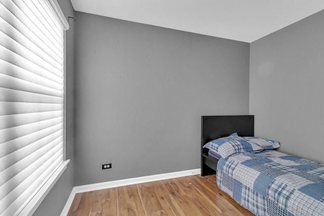 bedroom with light wood-type flooring