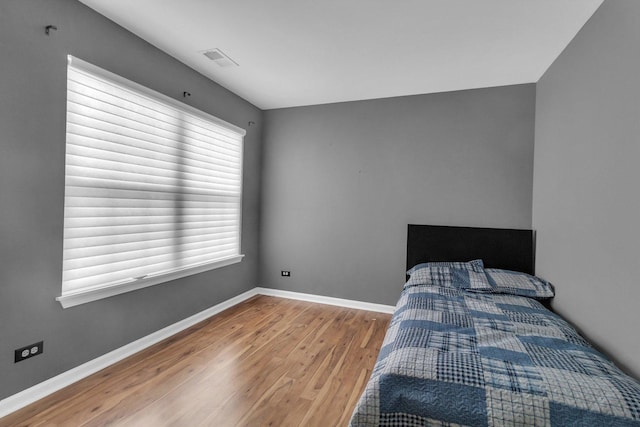 bedroom featuring hardwood / wood-style floors