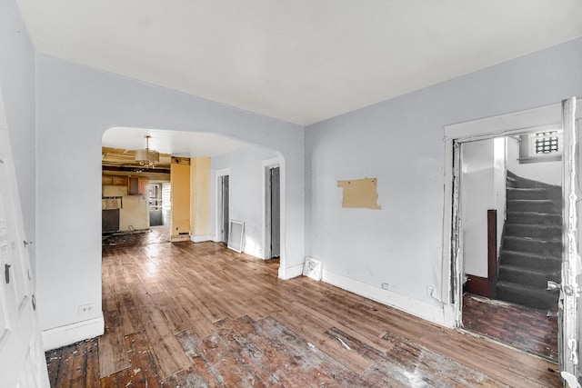 unfurnished living room featuring hardwood / wood-style floors