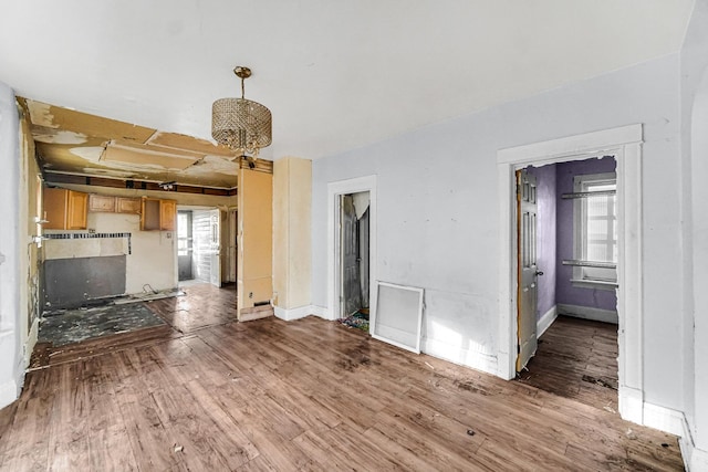 unfurnished living room with wood-type flooring