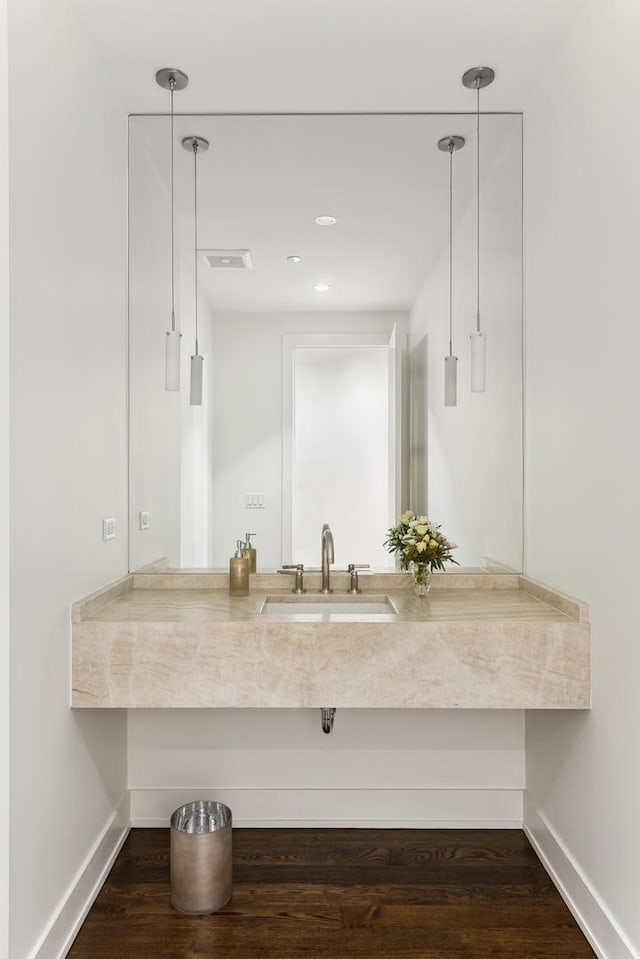 bathroom featuring hardwood / wood-style flooring and vanity