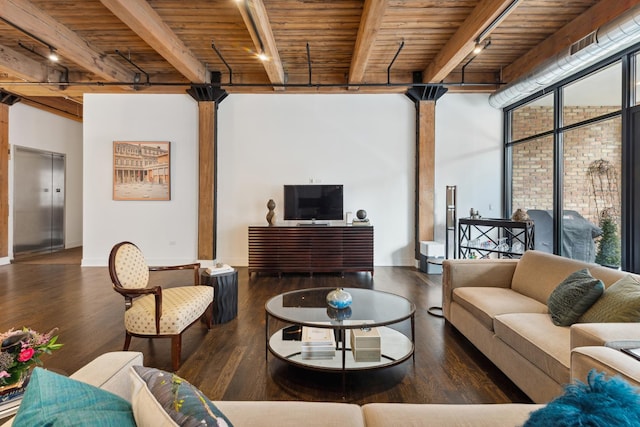 living room with decorative columns, wood ceiling, dark wood-type flooring, beamed ceiling, and elevator