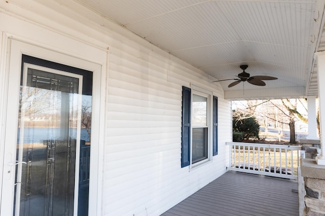 wooden deck with ceiling fan and a porch