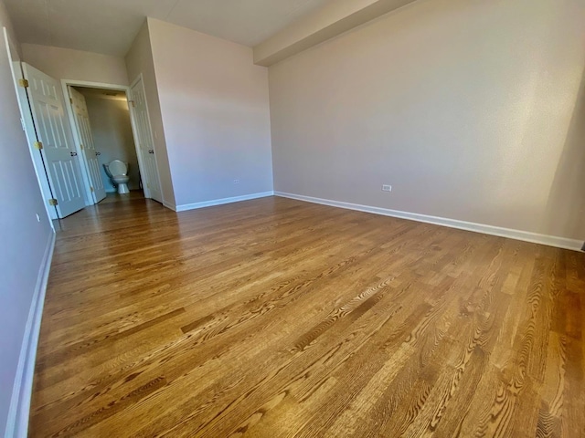 empty room featuring hardwood / wood-style flooring