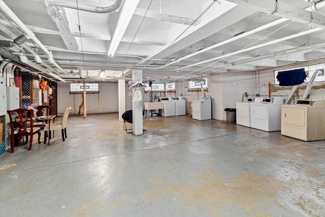 basement featuring washer and clothes dryer and sink