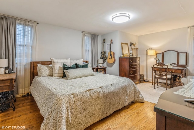 bedroom with hardwood / wood-style floors