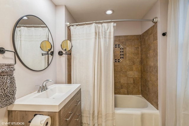 bathroom featuring vanity and shower / tub combo