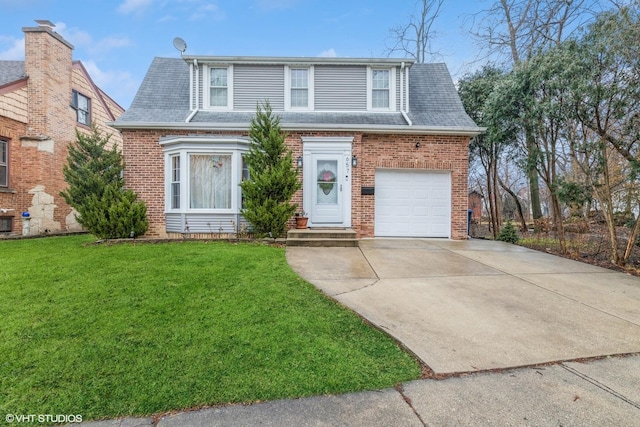 view of front facade with a front yard and a garage