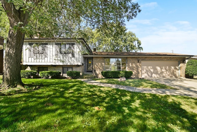 view of front of home with a garage and a front lawn