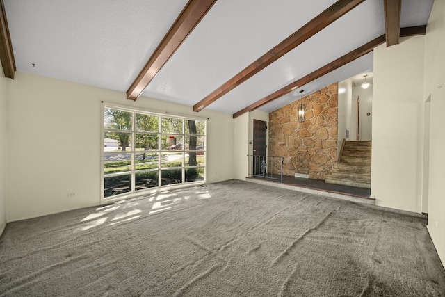 unfurnished living room featuring beamed ceiling, carpet flooring, and high vaulted ceiling