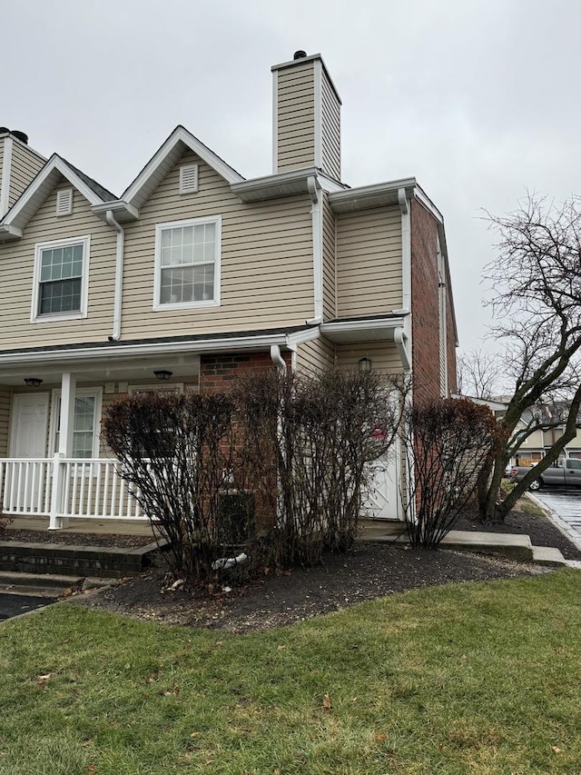 view of property exterior with a yard