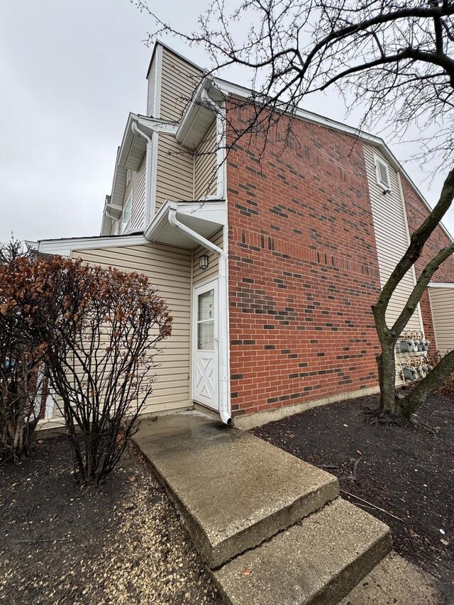 view of side of home featuring a lawn