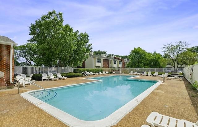 view of swimming pool featuring a patio area