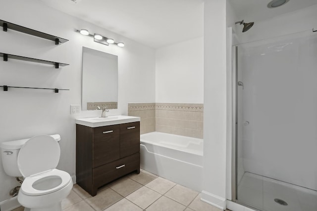 full bathroom featuring tile patterned floors, vanity, toilet, and shower with separate bathtub