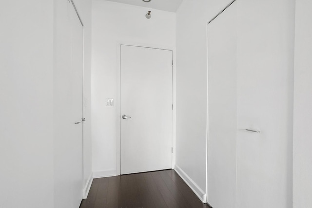 hallway featuring dark hardwood / wood-style floors