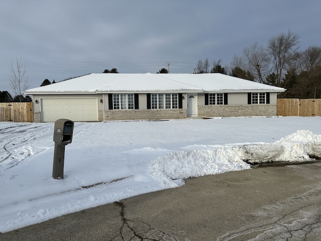 ranch-style house featuring a garage