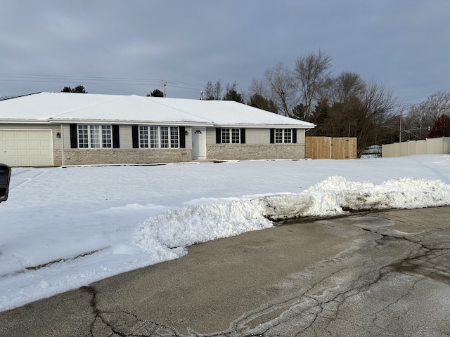 single story home with a garage