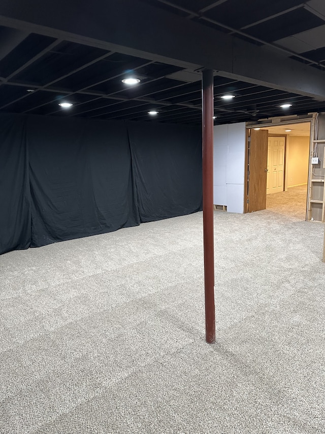 basement featuring carpet flooring