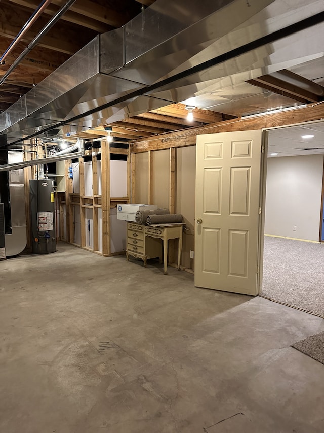 basement with carpet floors and gas water heater