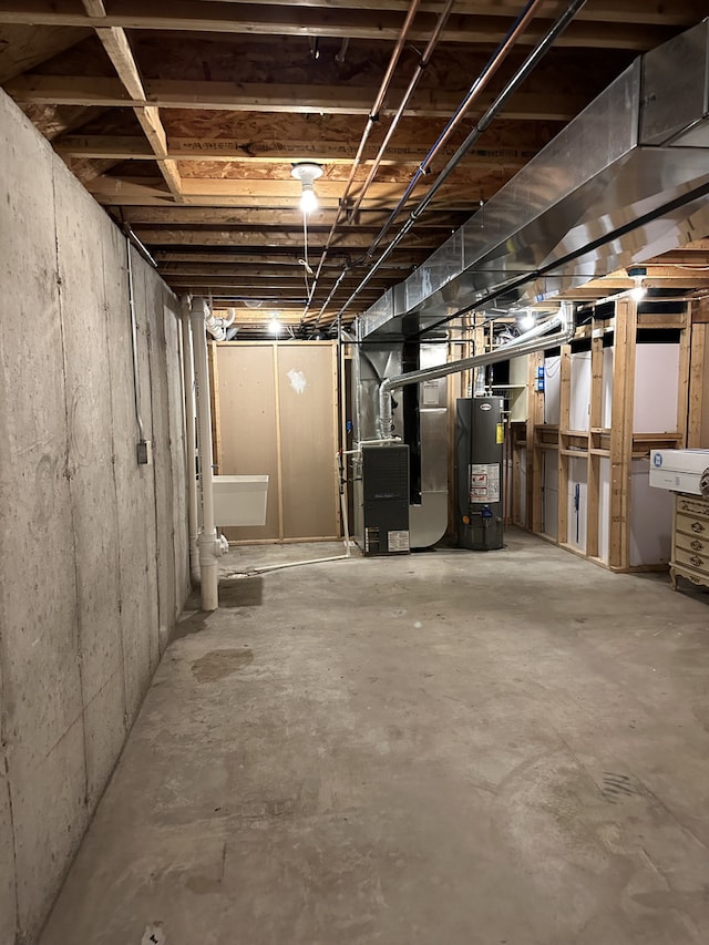 basement featuring gas water heater and heating unit