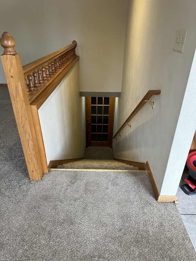 stairs featuring carpet