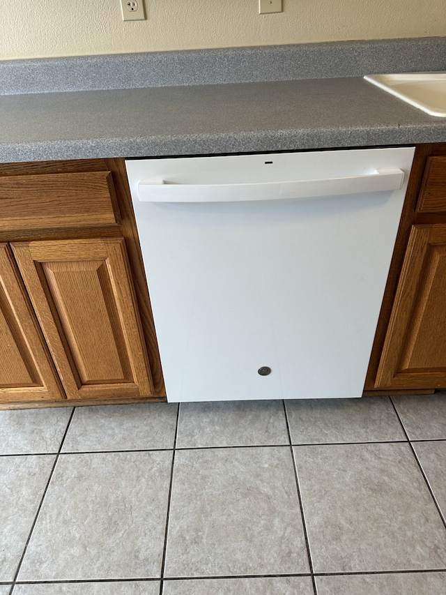 room details featuring white dishwasher and sink