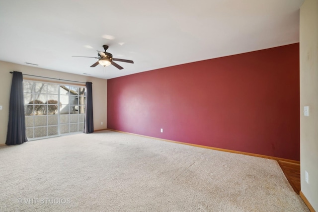 unfurnished room with ceiling fan and carpet floors