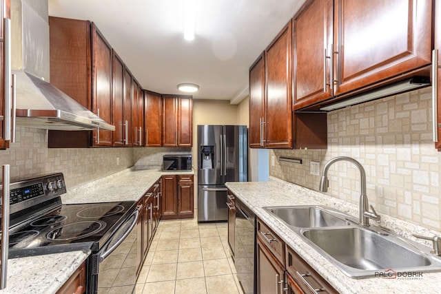 kitchen featuring black appliances, wall chimney range hood, sink, backsplash, and light tile patterned flooring