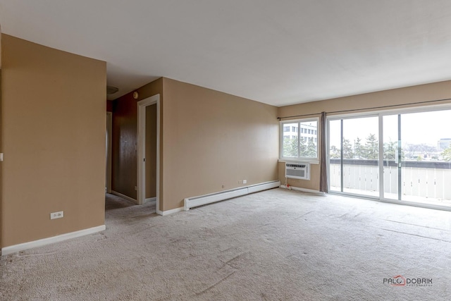 carpeted spare room with a baseboard heating unit and a wall unit AC