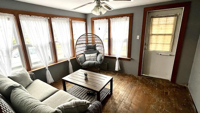 sunroom / solarium featuring ceiling fan