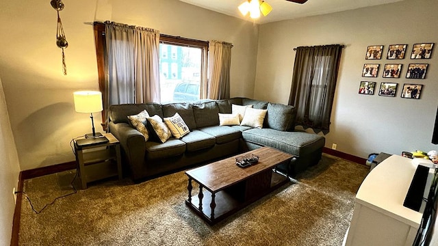 carpeted living room with ceiling fan