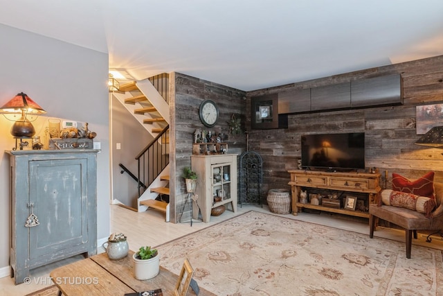 living room featuring wood walls