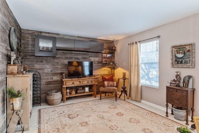 sitting room featuring wooden walls