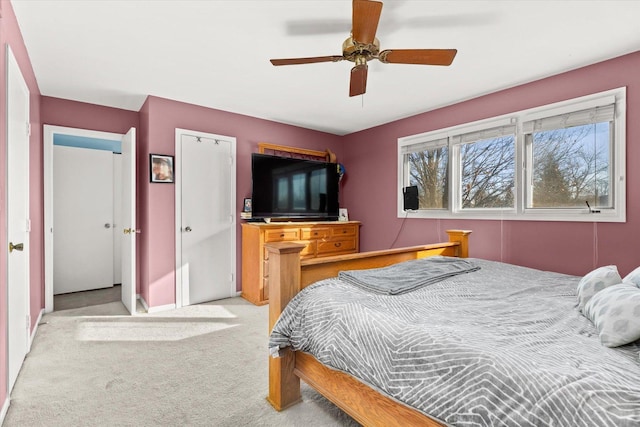 bedroom featuring ceiling fan and light colored carpet