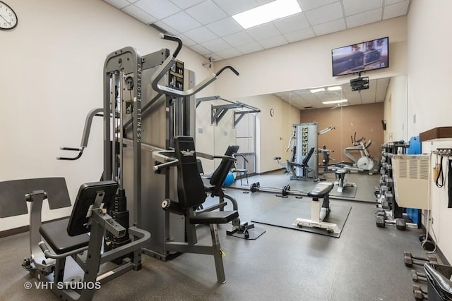 workout area with a paneled ceiling