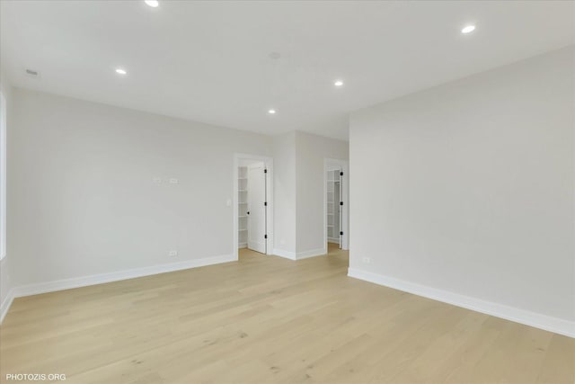 spare room featuring light hardwood / wood-style floors