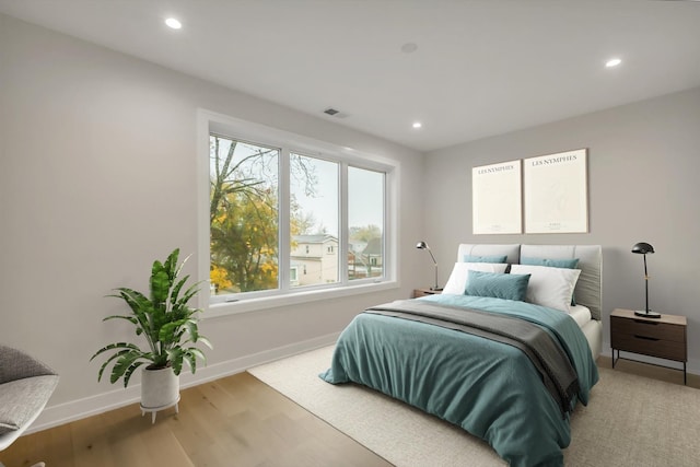 bedroom with wood-type flooring