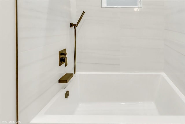 bathroom with shower / bathing tub combination