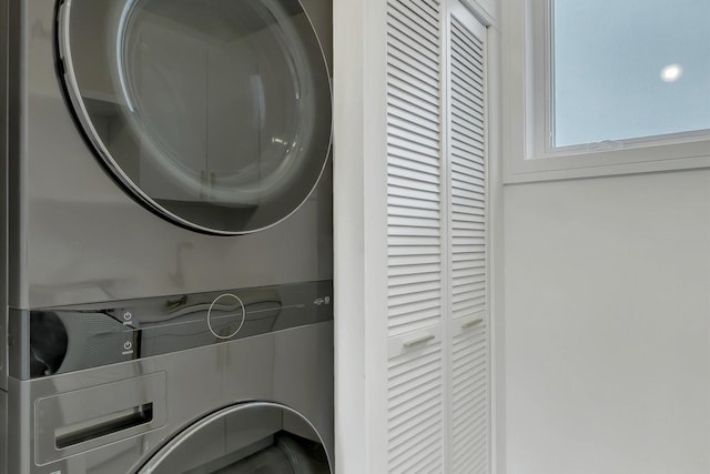 laundry area featuring stacked washer and clothes dryer