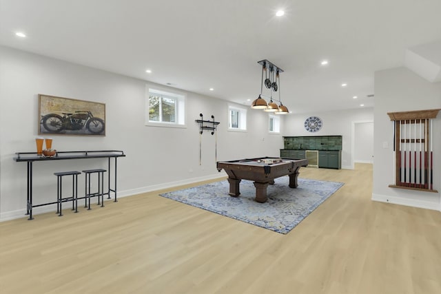 game room with pool table and light hardwood / wood-style flooring