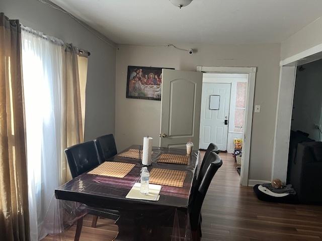 dining space featuring wood-type flooring