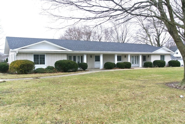 ranch-style home featuring a front yard