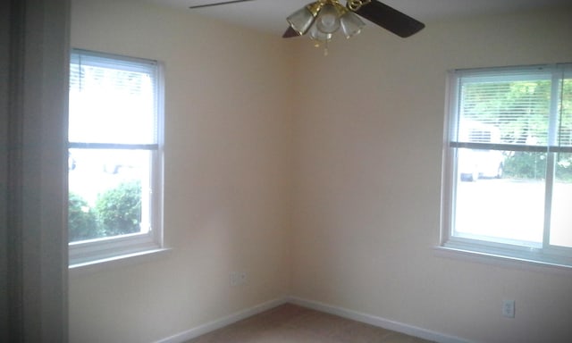 unfurnished room with ceiling fan