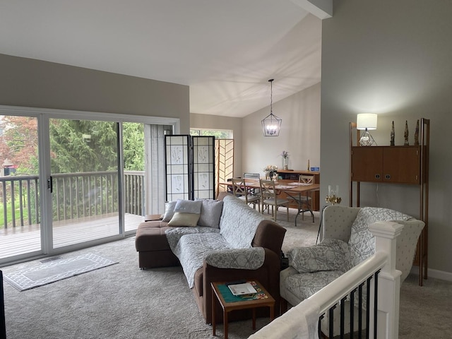 carpeted living room with lofted ceiling and a notable chandelier