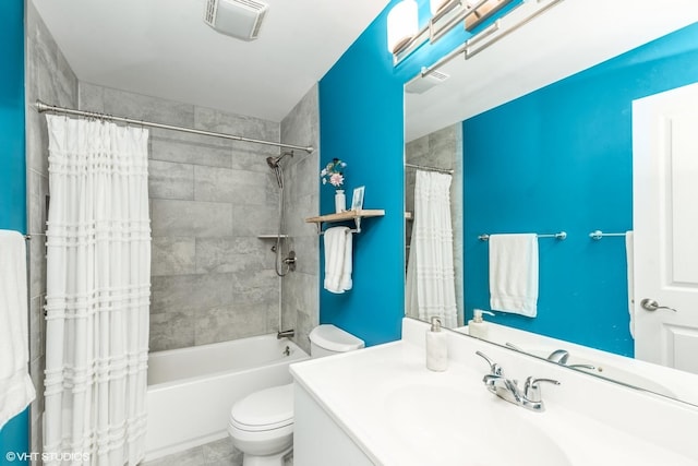 full bathroom featuring vanity, shower / bath combination with curtain, and toilet