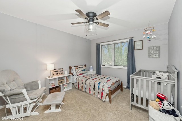 carpeted bedroom with ceiling fan